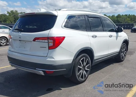 2021 Honda Pilot 2Wd Touring 8 Passenger from USA, damaged, VIN 5FNYF5H92MB001689